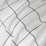 Housse de coussin tricotée en coton à carreaux