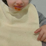 Plastic terry bib with yellow rubber