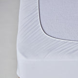 Protège-matelas pour berceau