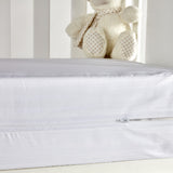 Crossed mattress cover for crib
