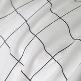 Housse de coussin tricotée en coton à carreaux